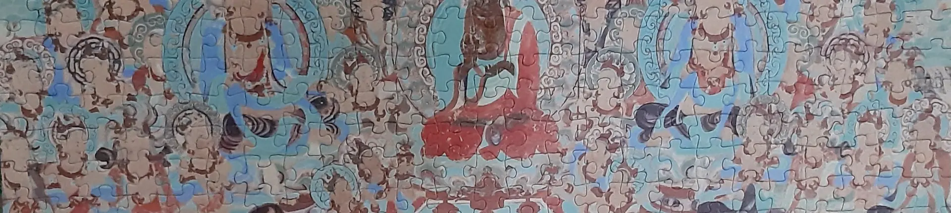 Colorful Buddhist mural with seated figures and patterned robes at Mogao Grottoes, Dunhuang