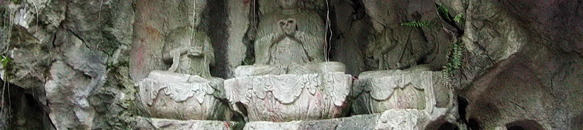 Stone Buddha figures carved into a rocky grotto at Feilai Peak near Lingyin Temple, Hangzhou