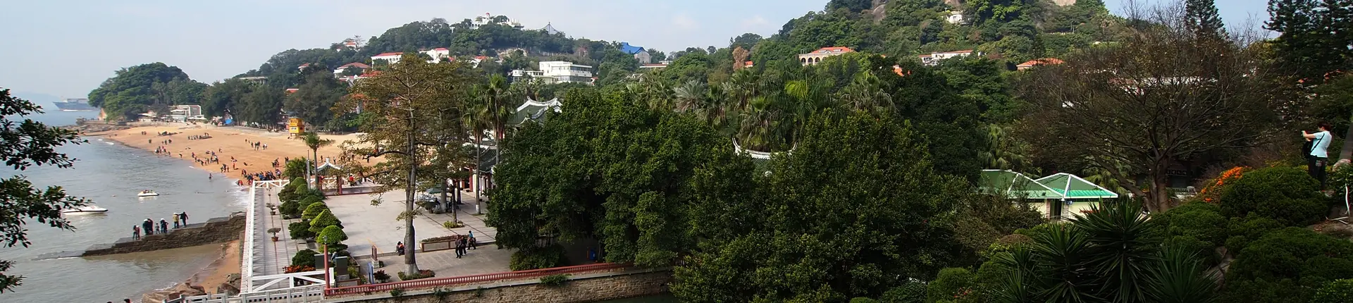 Coastal garden paths, trees and traditional pavilions at Shuzhuang Garden, Xiamen