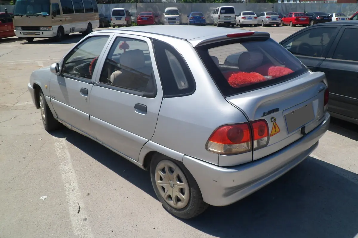 Rear view of a silver hatchback in an outdoor car park