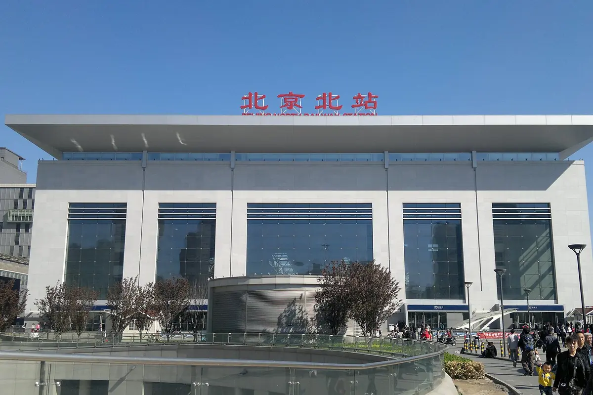 Beijing North Railway Station's white facade with red Chinese roof signage
