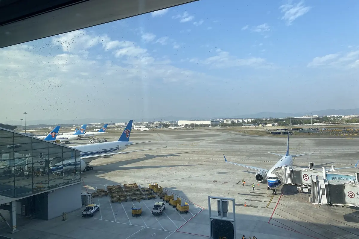 View of parked China Southern Airlines airplanes, seen from within Guangzhou Baiyun Airport Terminal 2