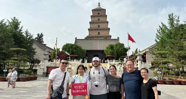 Visitors stand before the Giant Wild Goose Pagoda and temple courtyard in Xi'an